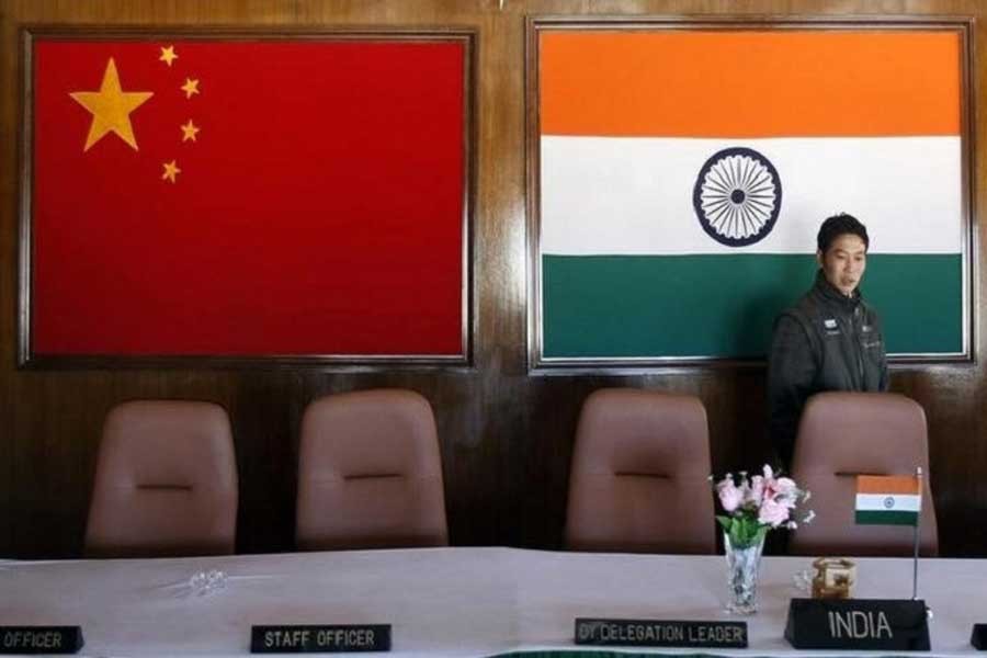 A man walks inside a conference room used for meetings between military commanders of China and India, at the Indian side of the Indo-China border at Bumla, in Arunachal Pradesh, Nov 11, 2009. Reuters