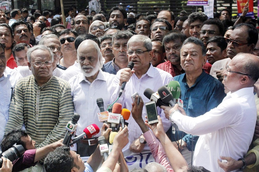 BNP secretary general Mirza Fakhrul Islam Alamgir speaking at a human chain, as part of their  +98countrywide programme, protesting violence on Rohingya migrants in front of the National Press Club in the city on Friday.	— Focus Bangla