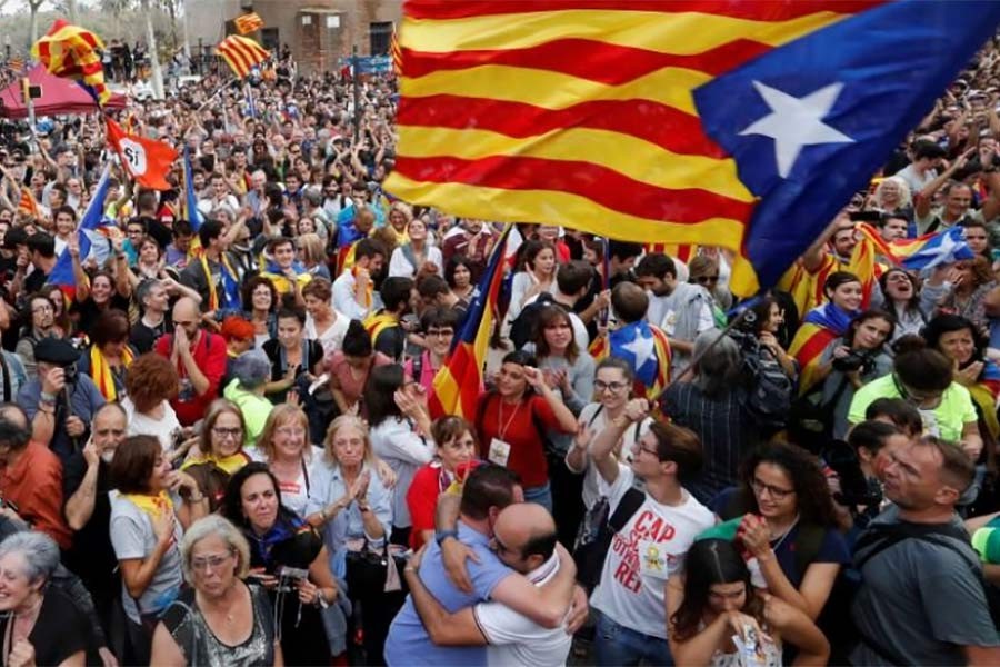 People celebrate after the Catalan regional parliament passes the vote of independence from Spain in Barcelona, Spain on Friday. Photo: Reuters
