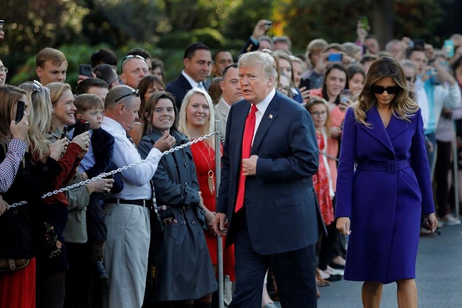 US President Donald Trump and First Lady Melania Trump greet visitors as they depart the White House for Asia, in Washington D.C., US November 3, 2017. Reuters