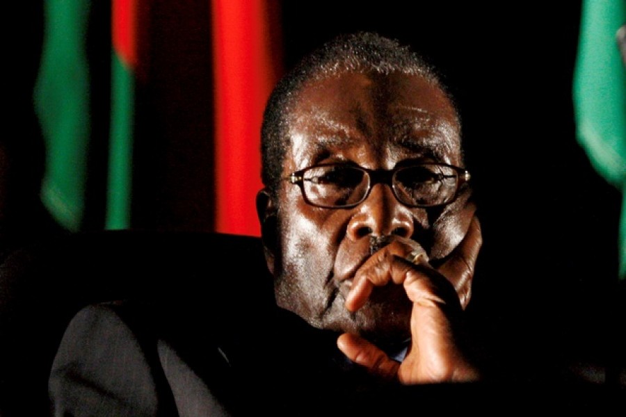 Zimbabwean President Robert Mugabe watches a video presentation during the summit of the Southern African Development Community (SADC) in Johannesburg, South Africa Aug 17, 2008. - Reuters