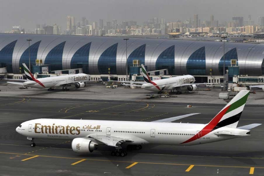 In this file photo, an Emirates plane taxis to a gate at Dubai International Airport at Dubai International Airport in Dubai, United Arab Emirates.  - AP Photo