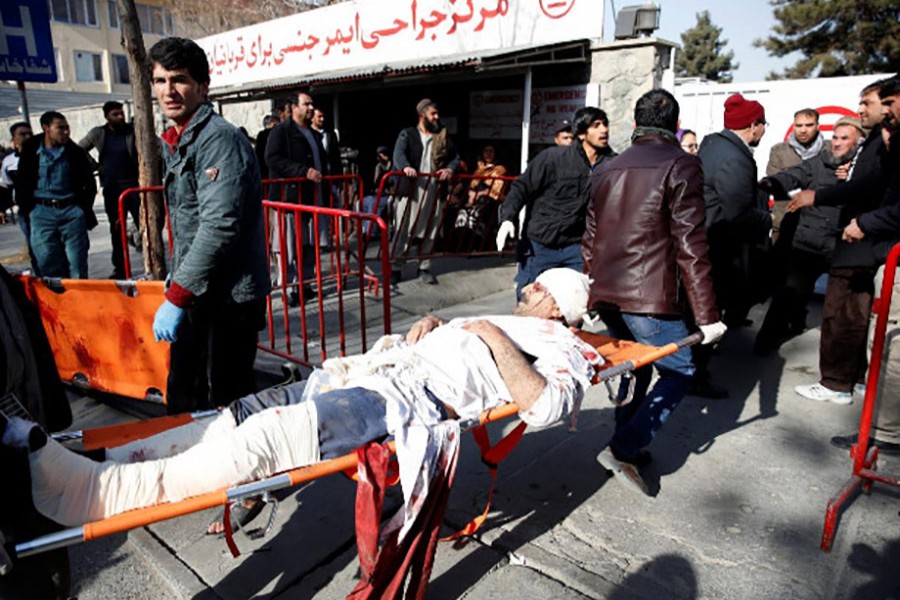 People carry an injured man to a hospital after a blast in Kabul, Afghanistan on Saturday. - Reuters photo