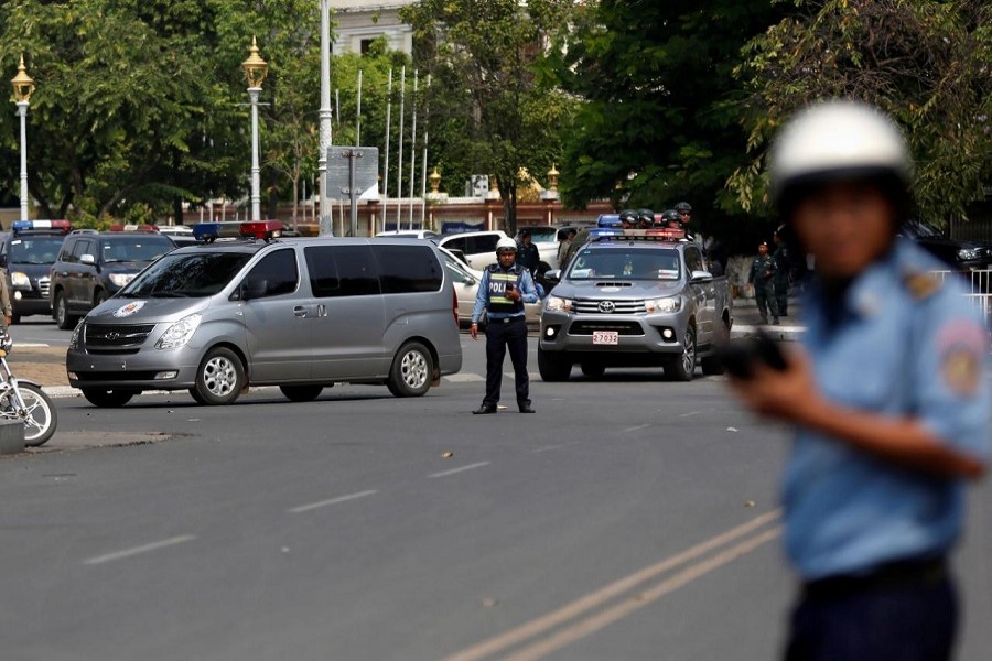Police vehicles escort Kem Sokha, former leader of the Cambodia National Rescue Party (CNRP), back to jail after a bail hearing at the Appeal Court in Phnom Penh, Cambodia, February 1, 2018. Reuters
