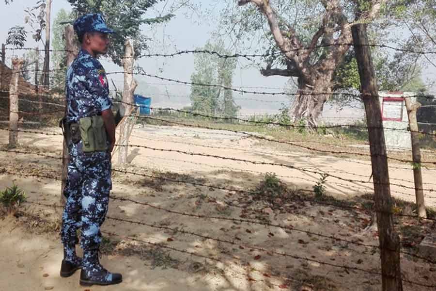 A Myanmar policeman stands outside of a camp  to prepare for the repatriation of displaced Rohingyas, who fled to Bangladesh, outside Maungdaw in the state of Rakhine, Myanmar, Jan 24, 2018. Reuters