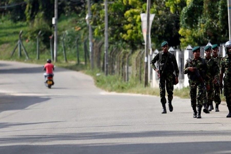 Sri Lanka Special Task Force soldiers patrol along a road after a clash between two communities in Digana, central district of Kandy, Sri Lanka March 8, 2018. Reuters/Files