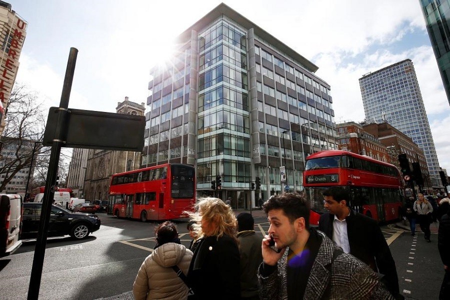 People walk past the building housing the offices of Cambridge Analytica in central London, Britain, March 20, 2018. Reuters