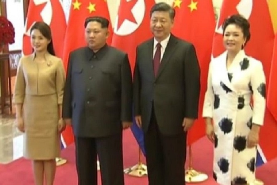 Chinese TV showed footage of the two leaders with their wives
