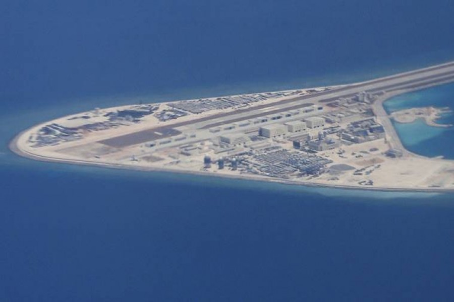 China defends military buildup in South China Sea