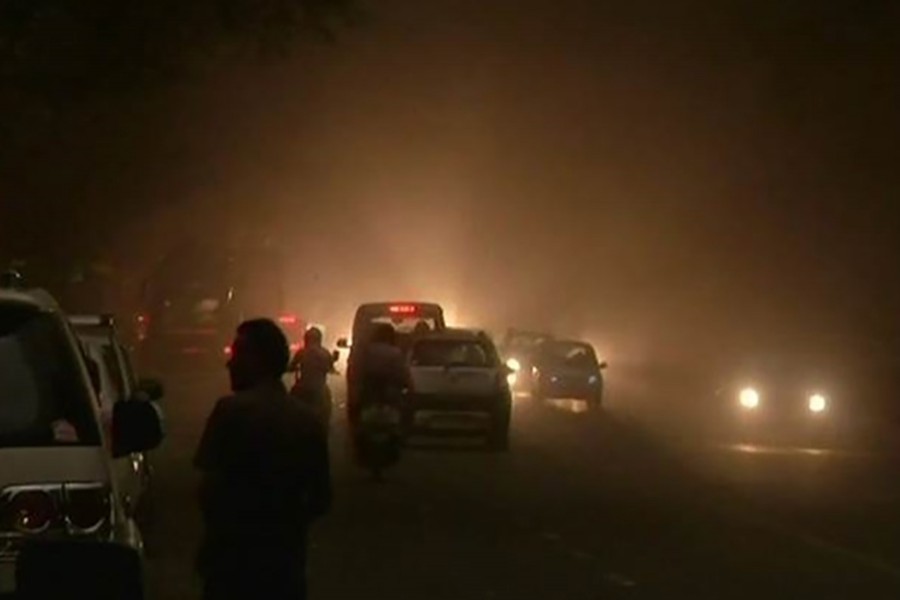 Wednesday's storm dipped the visibility, leading to vehicles plying on the streets coming to a standstill momentarily, while pedestrians rushed to seek shelter. Courtesy: ANI