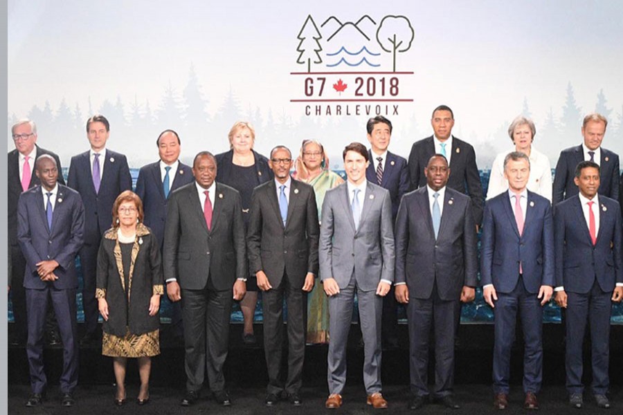 Prime Minister Sheikh Hasina is seen among others posing for a family photo of the G7 Outreach during the G7 summit in La Malbaie, Canada, June 9, 2018. Photo: PID