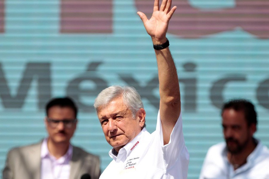 Leftist front-runner Andres Manuel Lopez Obrador of the National Regeneration Movement (MORENA) waves to supporters during his campaign rally in Ciudad Juarez, Mexico April 1, 2018. Reuters.