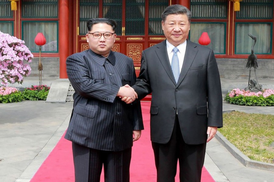 North Korean leader Kim Jong Un shaking hands with Chinese President Xi Jinping during a meeting in Beijing recently	— Reuters