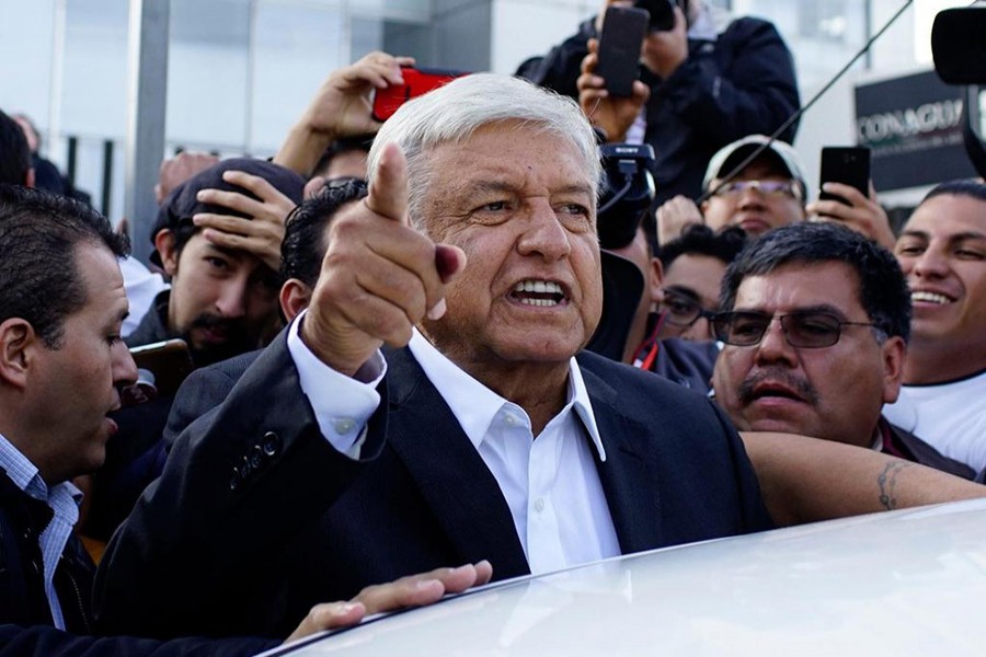 Presidential candidate Andres Manuel Lopez Obrador talks to reporters as he departs after casting his ballot at a polling station during the presidential election in Mexico City, Mexico on Sunday - Reuters photo