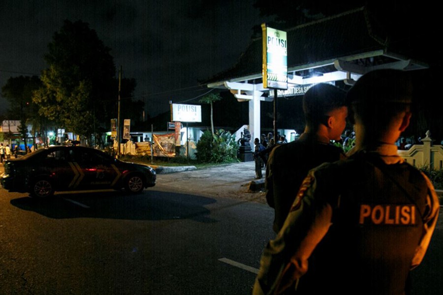 Indonesian police guard is seen near the scene of a shooting in Sleman, Yogyakarta, Indonesia on Saturday — Reuters photo