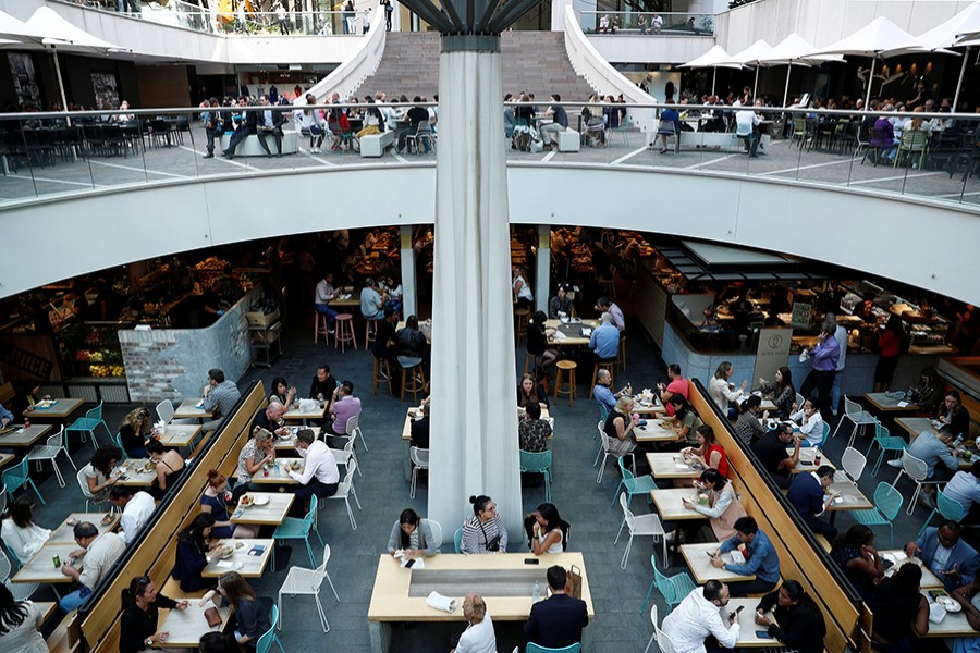 Office workers take their lunch at a food court in Sydney, Australia on May 4 last - Reuters/File