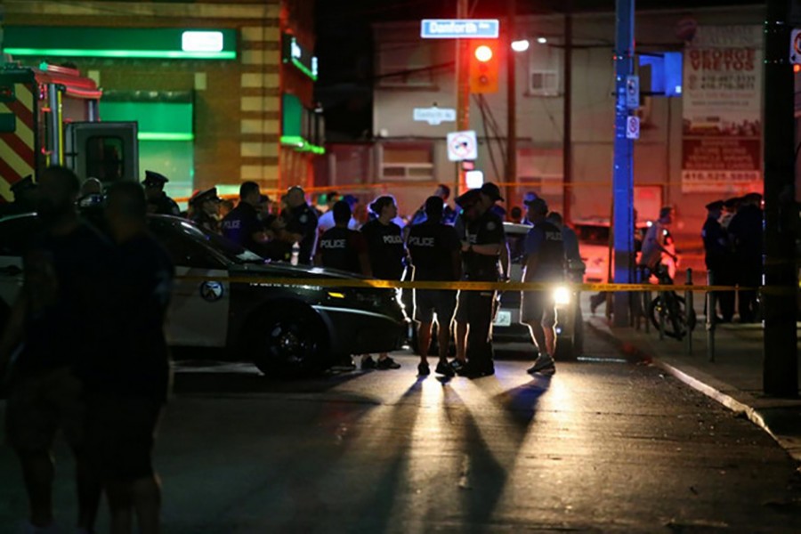Police are seen near the scene of a mass shooting in Toronto, Canada on Sunday — Reuters photo