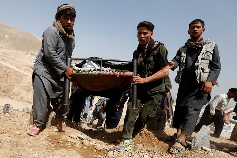 The wounded being moved on makeshift stretchers after suicide bombers killed 20 and injured 70 in Afghan capital Kabul on Wednesday — Reuters photo