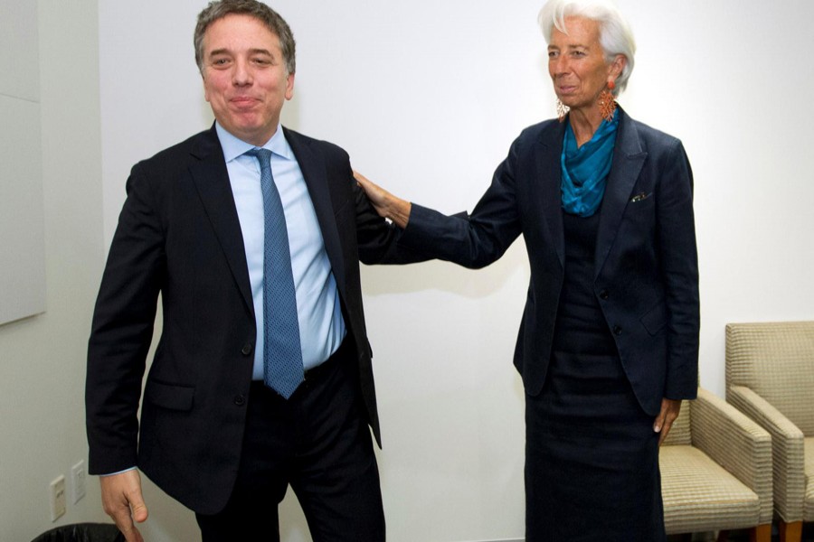 International Monetary Fund (IMF) Managing Director Christine Lagarde greets Argentine Treasury Minister Nicolas Dujovne at the IMF in Washington, US, September 4, 2018. Reuters