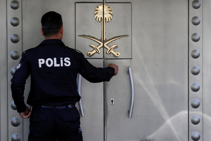A Turkish police officer who stands guard at the Saudi Arabia's consulate is seen at the entrance, in Istanbul, Turkey, October 10, 2018. Reuters