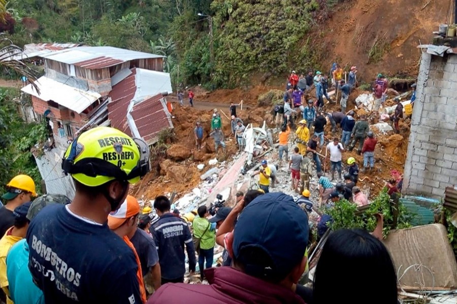 Rescue workers attend to the wreckage of a house destroyed by a landslide in Marquetalia, Colombia on Thursday — Caldas Department Press Office via AP