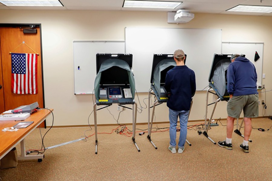 Americans cast their ballots on electronic machines while voting during midterm elections in San Juan Capistrano, California, US November 6, 2018. Reuters