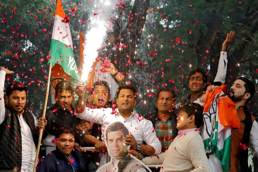 Supporters of India's main opposition Congress party celebrate after initial poll results at the party headquarters in New Delhi, India, December 11, 2018. Reuters/Files