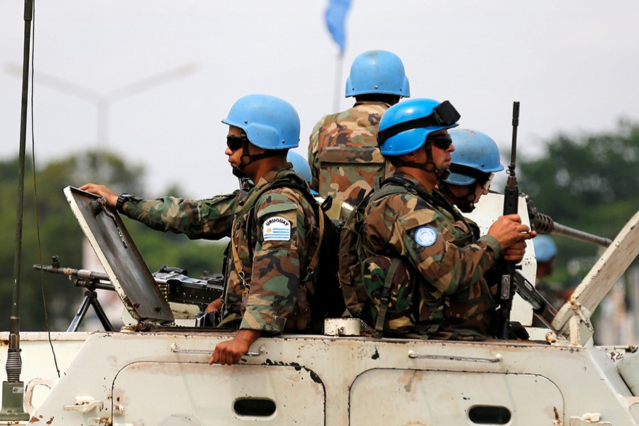 Peacekeepers serving in the United Nations Organization Stabilization Mission in the Democratic Republic of the Congo (MONUSCO) patrol in their armored personnel carrier on December 20, 2016 — Reuters/File