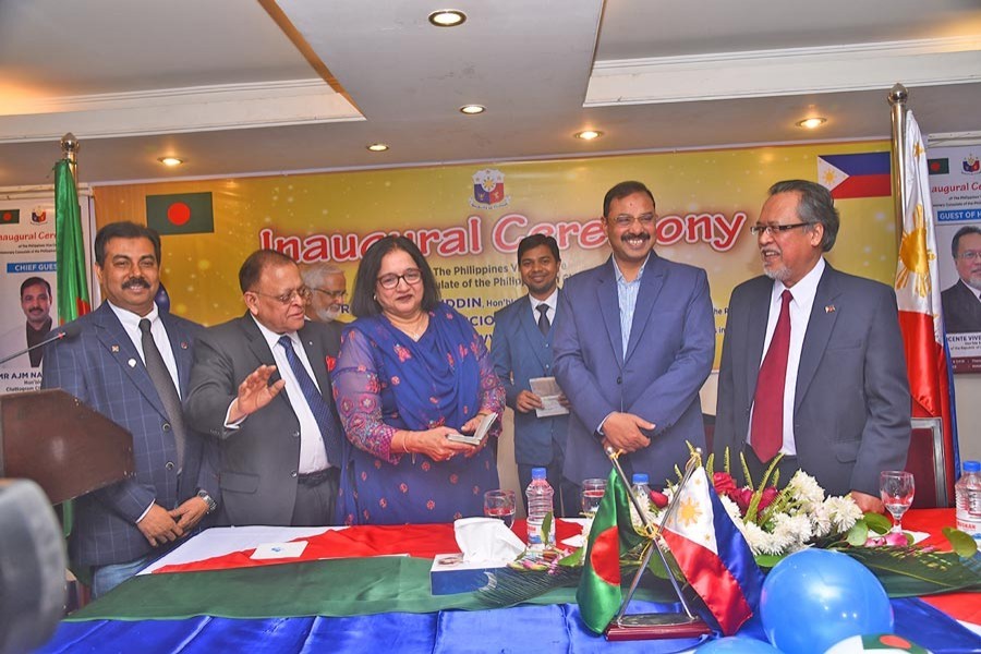 Chittagong City Corporation Mayor A J M Nasir Uddin, Philippines' Ambassador to Bangladesh Vincente Vivencio T Bandillo, Honorary Consul of the Philippines Mohammed A Awwal and others in a photo session at the inauguration of the Philippines' visa centre in the port city recently