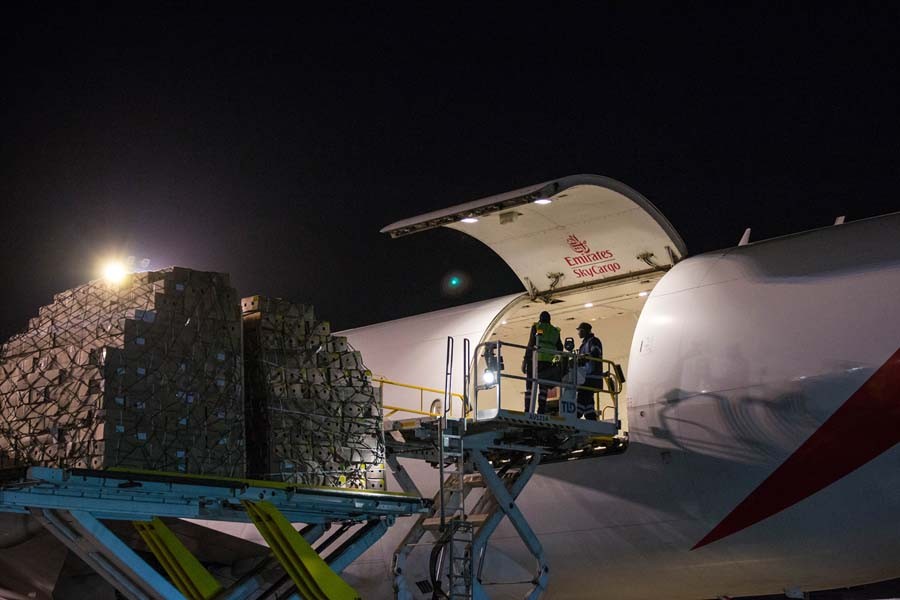 Boxes with flowers are being loaded to Emirates SkyCargo freighter