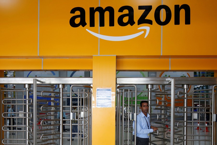 An employee of Amazon walks through a turnstile gate inside an Amazon Fulfillment Centre (BLR7) on the outskirts of Bengaluru, India, September 18, 2018. Reuters/Files