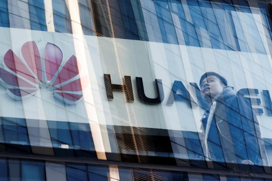 A man walks past a Huawei shop in Beijing, China, March 7, 2019. Reuters