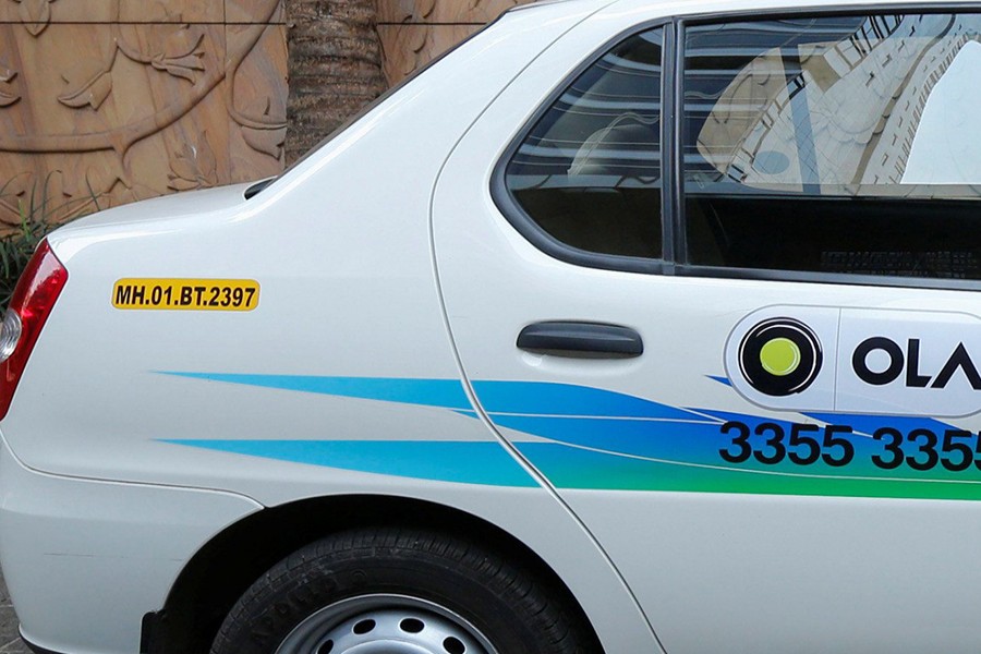 The logo of Ola seen on a Taxi's door in this Reuters file photo
