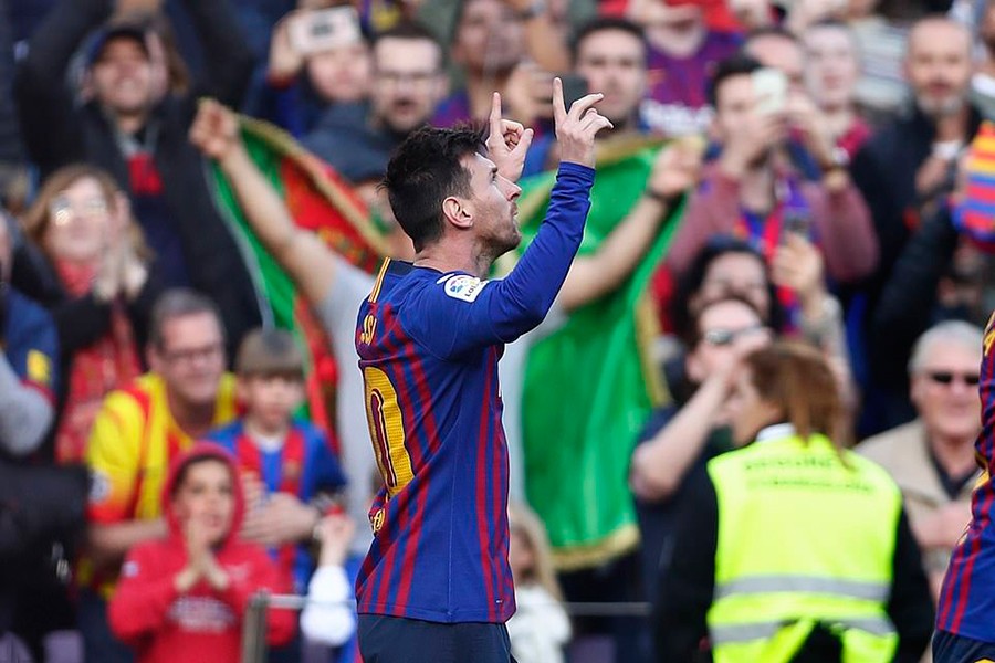 Barcelona talisman Lionel Messi looks to the sky as he celebrates one of his goals against Espanyol on Saturday — AP photo
