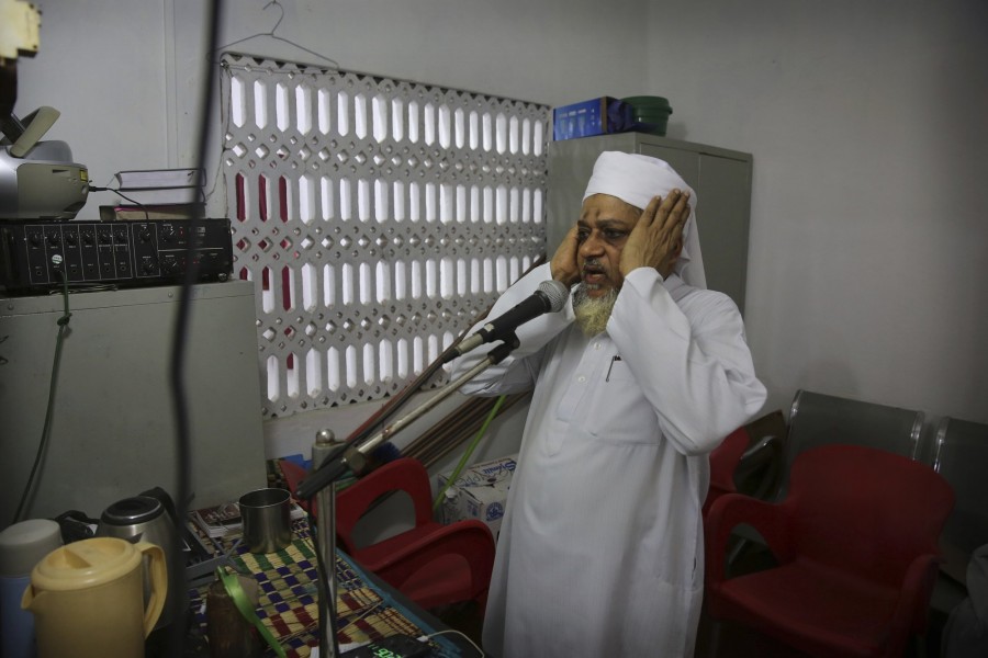 An imam calls for Friday prayers from a mosque, in Colombo, Sri Lanka, Friday, April 26, 2019. -AP