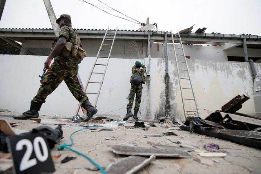 Security personnel seen at the site of an overnight gun battle between troops and suspected Islamist militants, on the east coast of Sri Lanka, in Kalmunai, April 27, 2019. Reuters