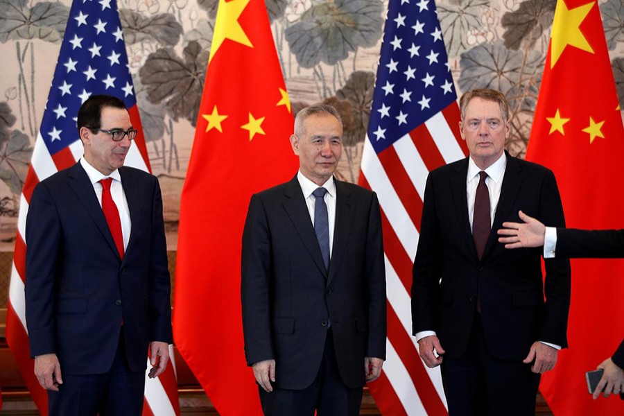 Chinese Vice Premier Liu He (C), US Treasury Secretary Steven Mnuchin (L) and US Trade Representative Robert Lighthizer arrive for a group photo session after concluding their meeting at the Diaoyutai State Guesthouse in Beijing, China on May 1, 2019 — Reuters/Files