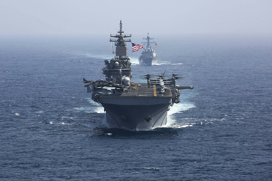The US Navy amphibious assault ship USS Kearsarge and the Arleigh Burke-class guided-missile destroyer USS Bainbridge sail in the Arabian Sea May 17, 2019 — US Navy/Mass Communication Specialist 1st Class Brian M Wilbur/Handout via Reuters