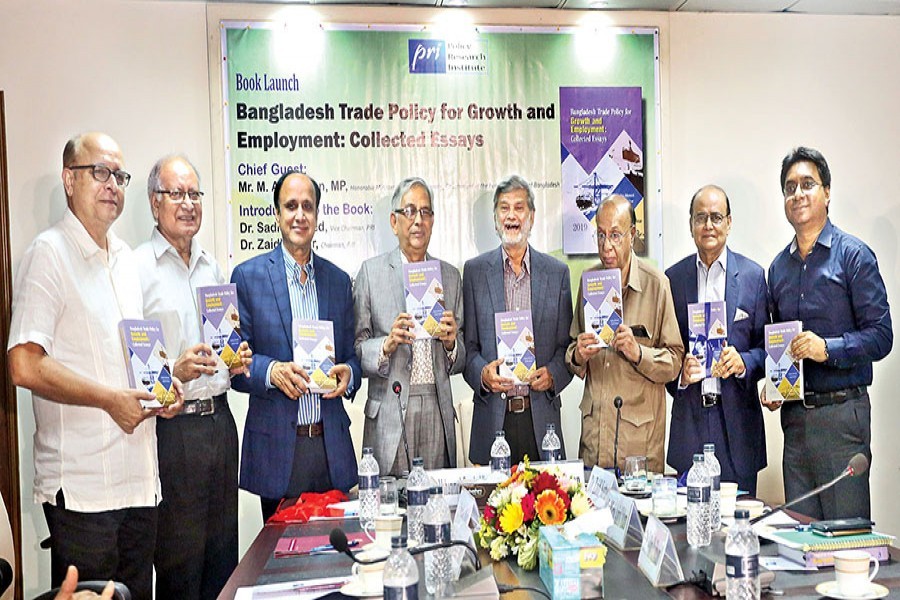Planning Minister MA Mannan (4th from right), PRI Chairman Dr Zaidi Sattar (2nd from right) and others seen at the publication ceremony of the book "Bangladesh Trade Policy for Growth and Employment: Collected Essays" at PRI conference room in the city on Saturday — FE photo