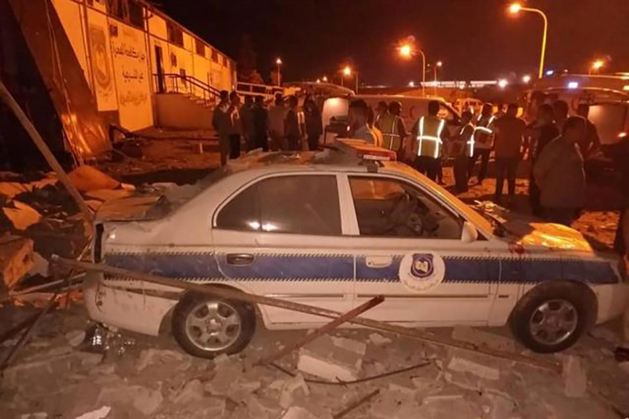 Security and emergency personnel work at site of an air strike at a detention centre for mainly African migrants, in a suburb of Tripoli, Libya on Wednesday in this image obtained from social media. Courtesy of Jihaz Mukafahat Alhijrat Alghyr Shareia via Reuters