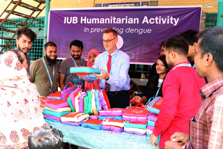 IUB distributes mosquito nets among slum dwellers
