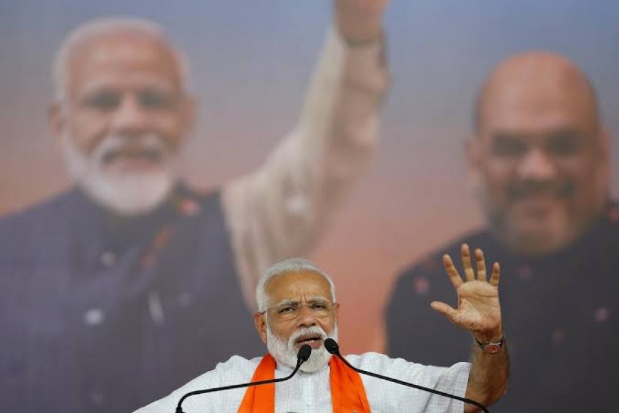 FILE PHOTO: India's Prime Minister Narendra Modi gestures as he addresses his supporters during a public meeting in Ahmedabad, India, May 26, 2019. REUTERS/Amit Dave