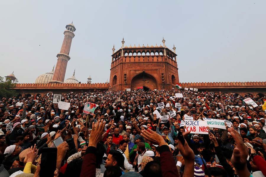 Demonstrators attending a protest against a new citizenship law, after Friday prayers at Jama Masjid in the old quarters of Delhi, India on Friday. -Reuters Photo