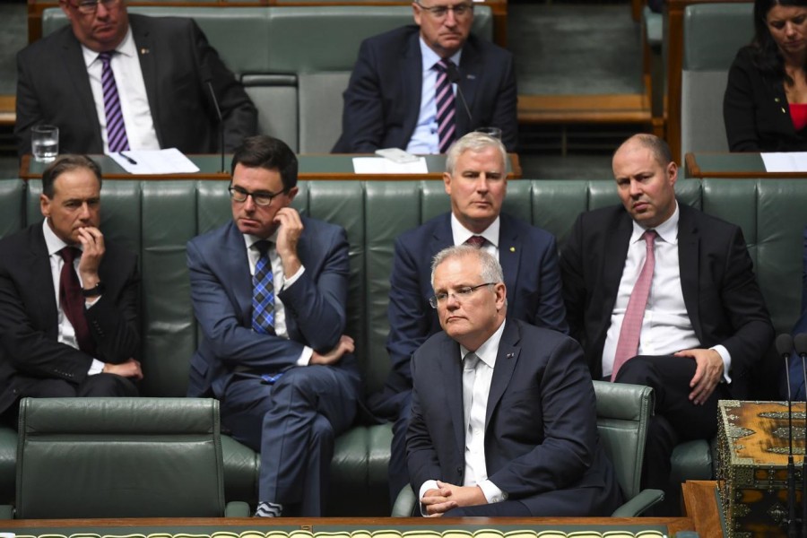 Australian Prime Minister Scott Morrison reacts during the bushfire condolence motion in the House of Representatives at Parliament House in Canberra, Australia, February 4, 2020. AAP Image/Lukas Coch/via REUTERS