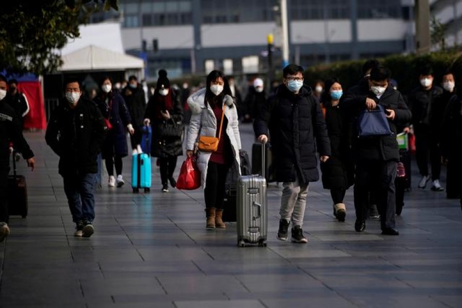 Passengers wearing masks walk at the Shanghai railway station in China, as the country is hit by an outbreak of the novel coronavirus, February 09, 2020. Reuters/Files