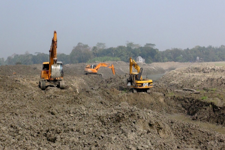 Work going on in full swing on the bank of the Arial Khan river to prevent erosion in Faridpur — FE Photo