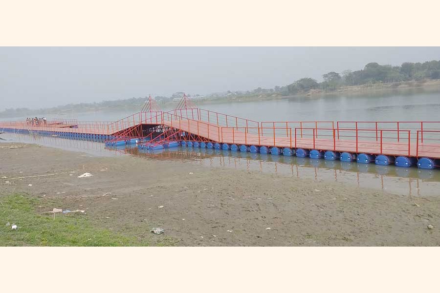 The floating bridge over the Modhumoti river in Togarbandh union under Alfadanga upazila of Faridpur district	— FE Photo