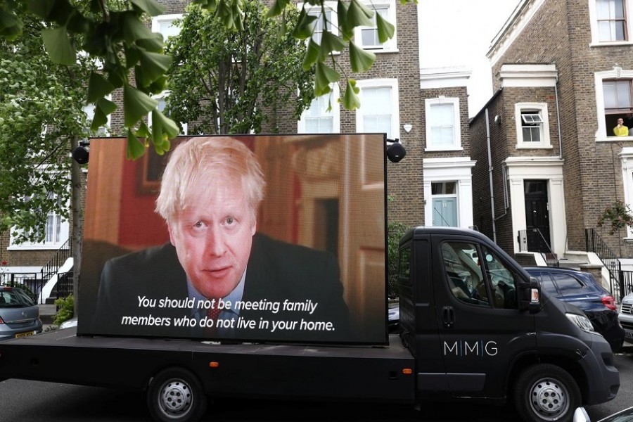 A "Led by donkeys" truck displaying a video of Britain's Prime Minister Boris Johnson, drives by Dominic Cummings' house in London, following the outbreak of the coronavirus disease (COVID-19), London, Britain, May 24, 2020. — Reuters