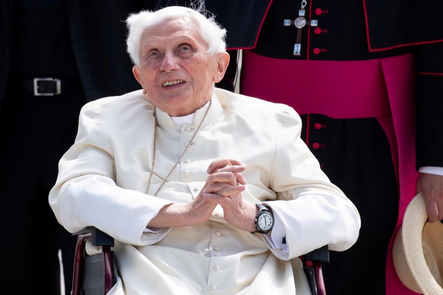 FILE PHOTO: Pope Emeritus Benedict XVI gestures at Munich Airport before leaving for Rome, June 22, 2020. Sven Hoppe/Pool via REUTERS