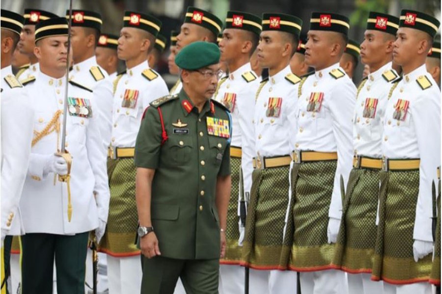 Malaysia's King, Al-Sultan Abdullah Ri’ayatuddin Al-Mustafa Billah Shah, inspects an honour guard during the 62nd Merdeka Day (Independence Day) celebrations in Putrajaya, Malaysia, August 31, 2019. Reuters